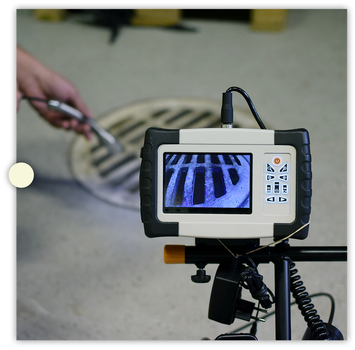 using a snake camera to view inside a sink drain