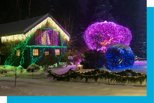 Christmas lights on house and trees