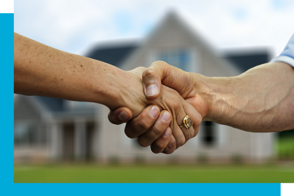 customer shaking hands outside of house