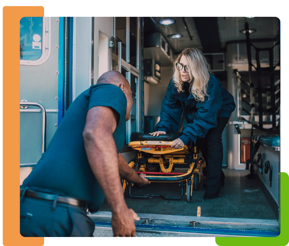 an EMS team pulling a gurney out of the ambulance truck