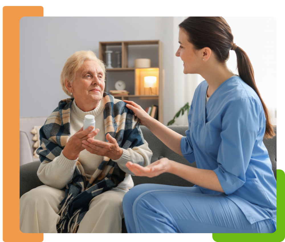 a home help nurse talking to an elderly woman about her medications while sitting on the couch