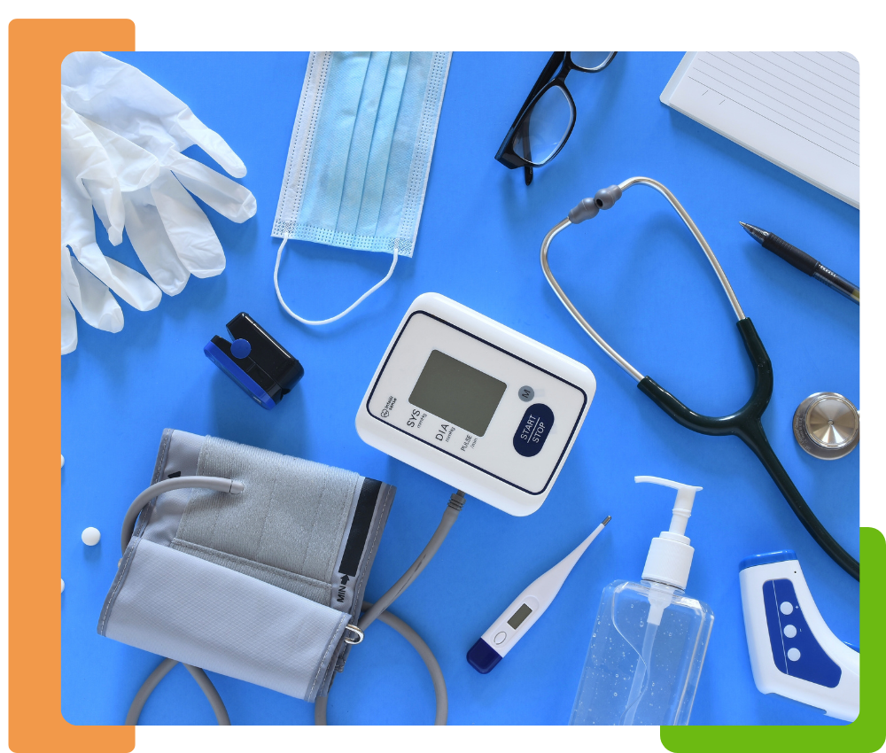 a table with a range of different medical devices like masks, gloves, electronics 