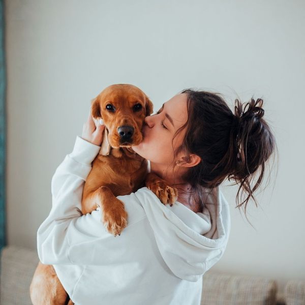 owner holding her dog