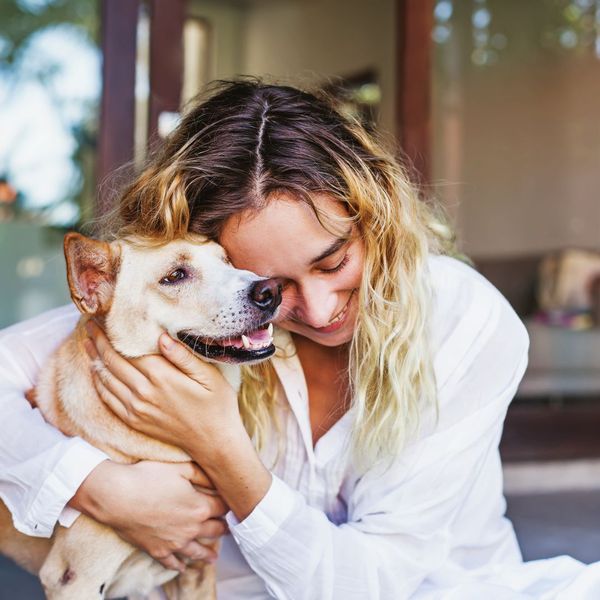 Woman hugging her dog