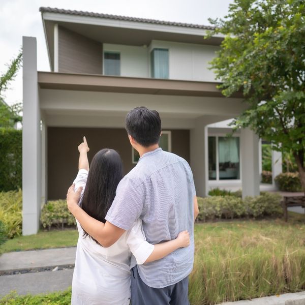 Homeowners looking at house 