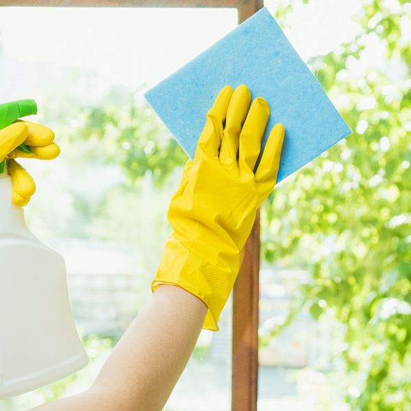 person washing window