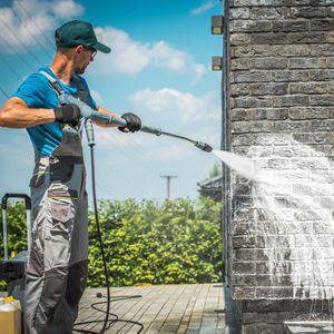 power washing a wall