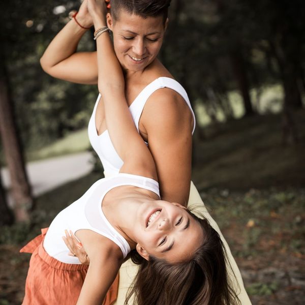 mother and teen daughter dancing