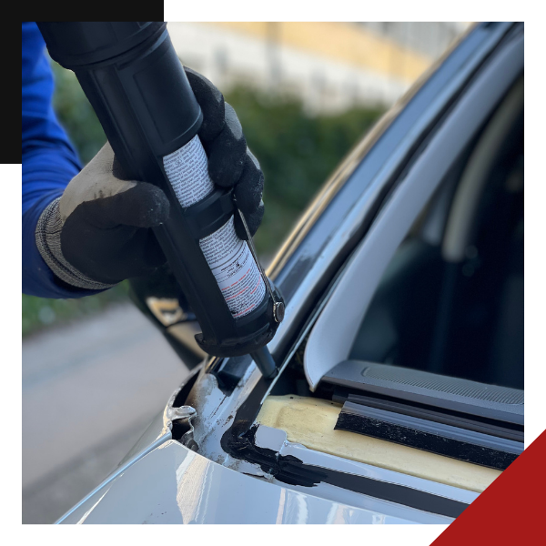 Technician removes windshield