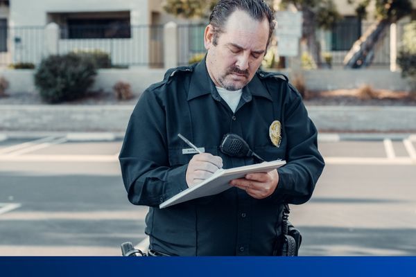 Police Officer takes notes 