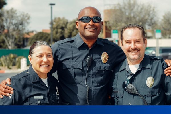 3 police officers stand together 