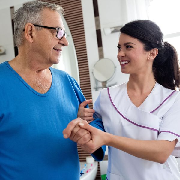 caregiver with an elderly man