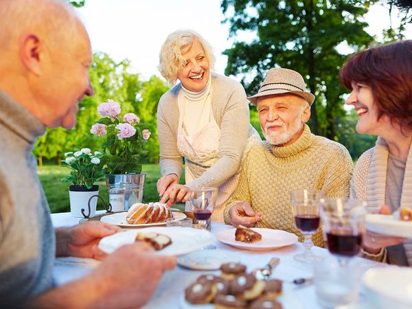 elderly couple enjoying company at home