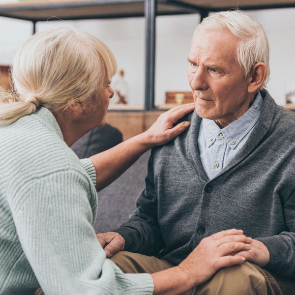 confused elderly man with wife 