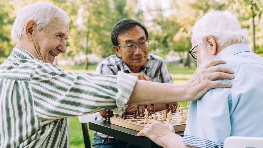 group of elderly men playing chest 