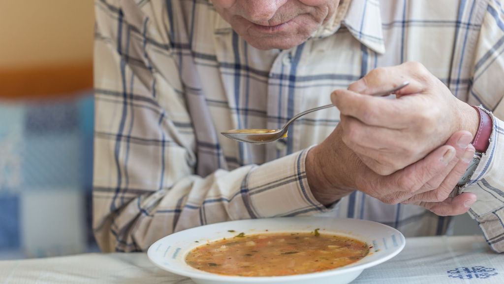 person with Parkinson's eating