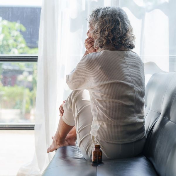 woman looking out the window