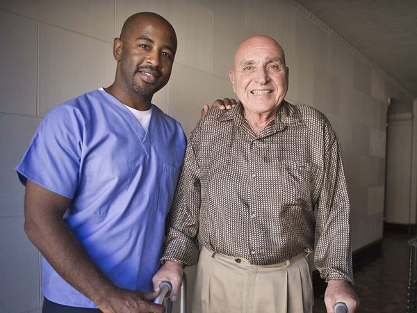 Portrait of a male healthcare worker with elderly man