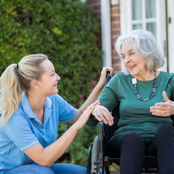caregiver outside with woman 