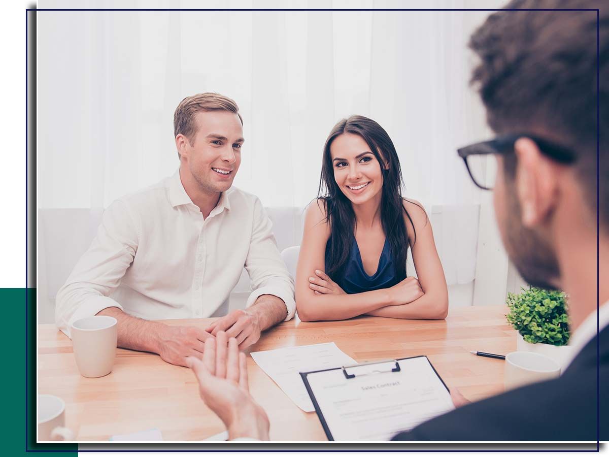 Couple talking to agent