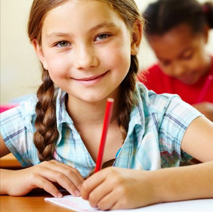 young girl doing schoolwork