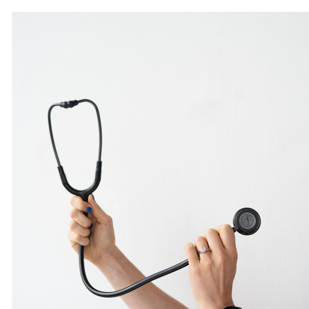 nurse holding up a stethoscope. 