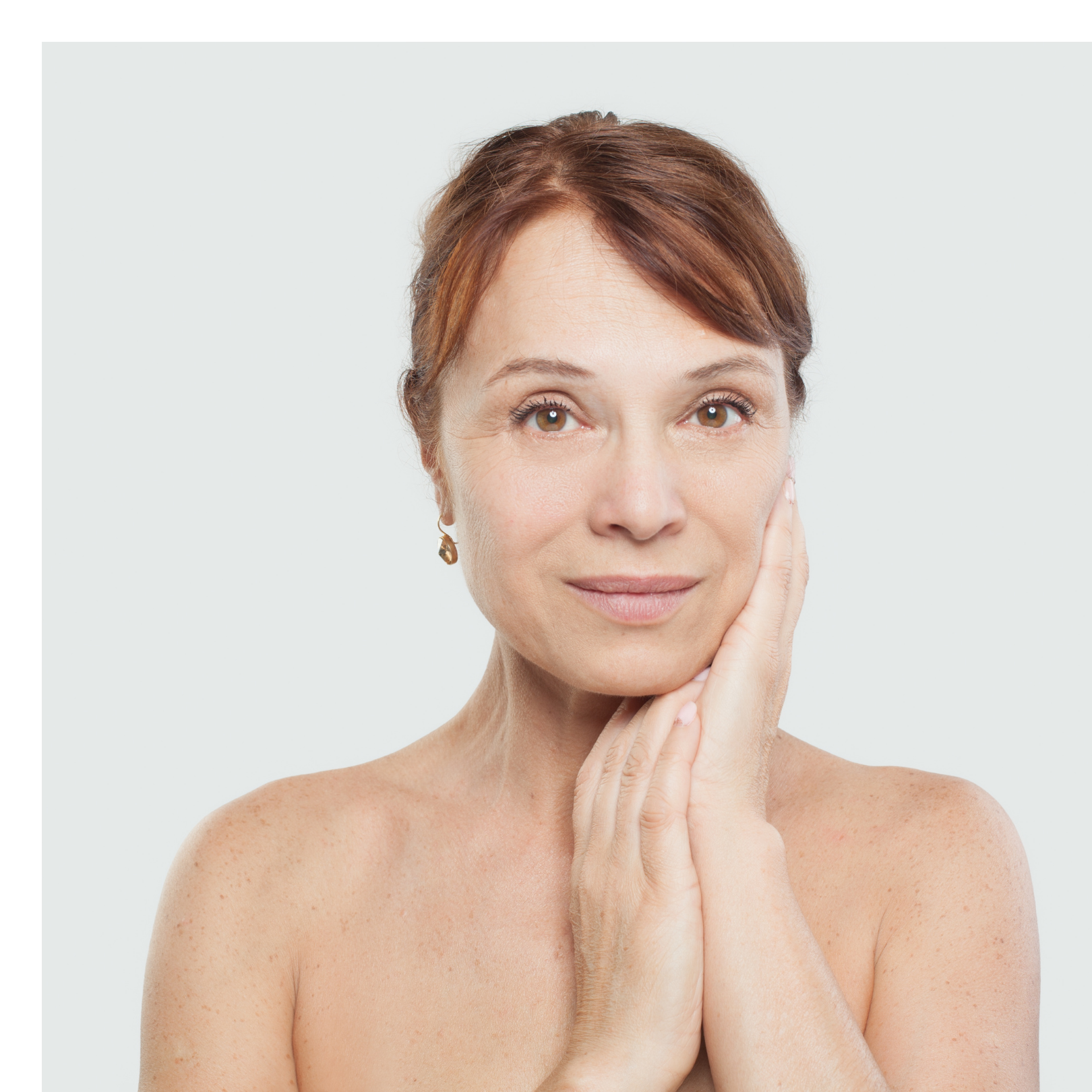 woman caressing her face. 