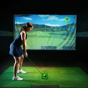 woman practicing her swing at X Golf