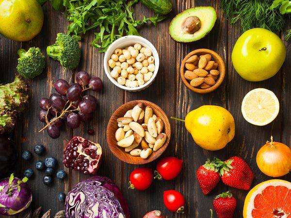  Colorful fruits and vegetables against a wooden backdrop