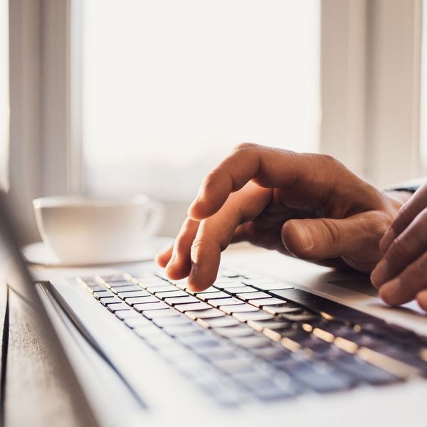 person typing on a keyboard