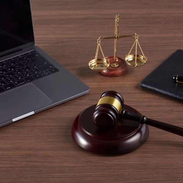judges gavel, scales of justice, and a computer