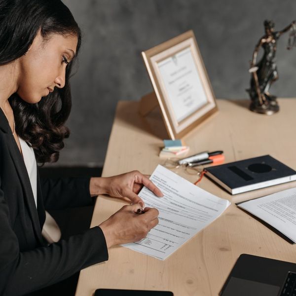 A lawyer looking over documents.