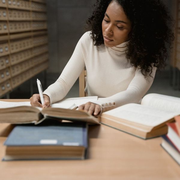 a woman searching through various documents