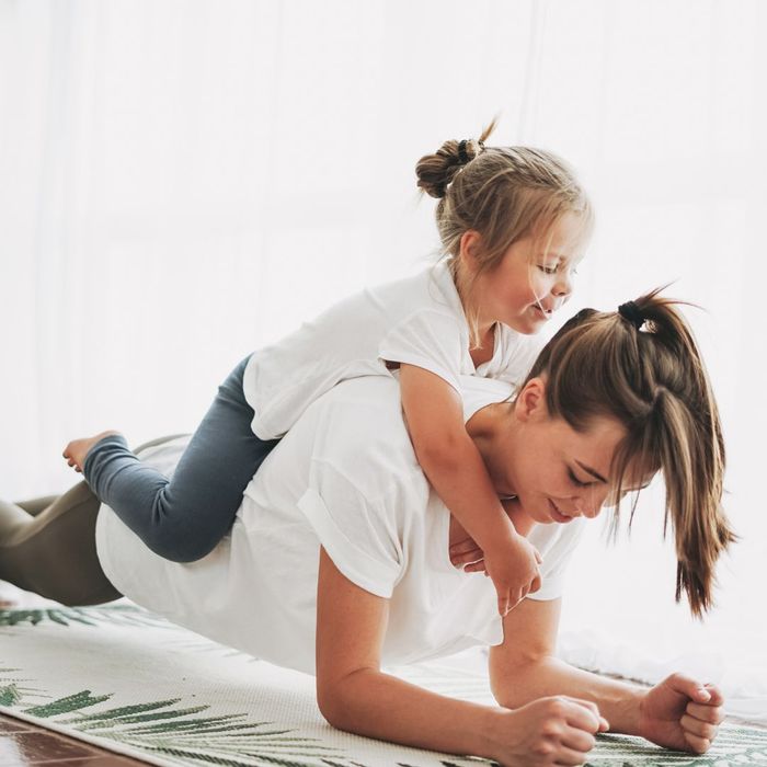 woman with kid on her back