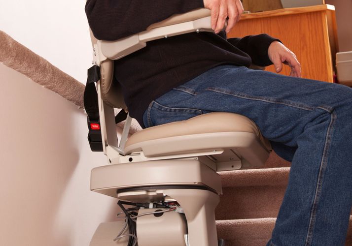 man using stair lift