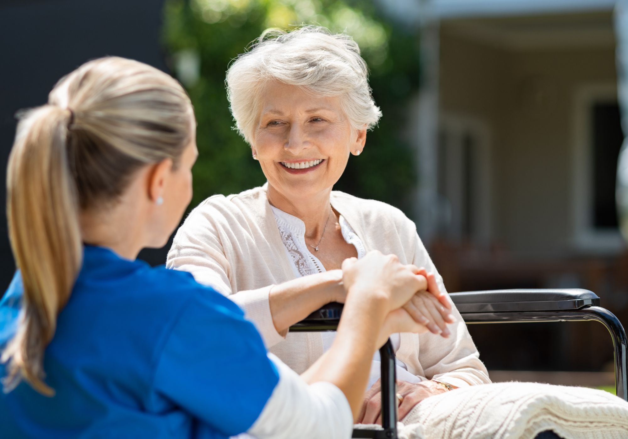 happy elderly woman and medical worker