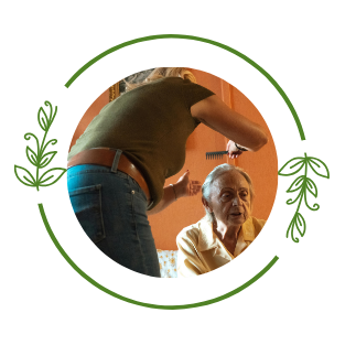 caregiver helping resident with her hair