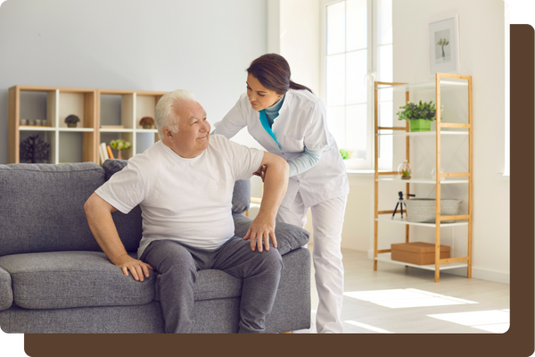 caregiver helping resident stand