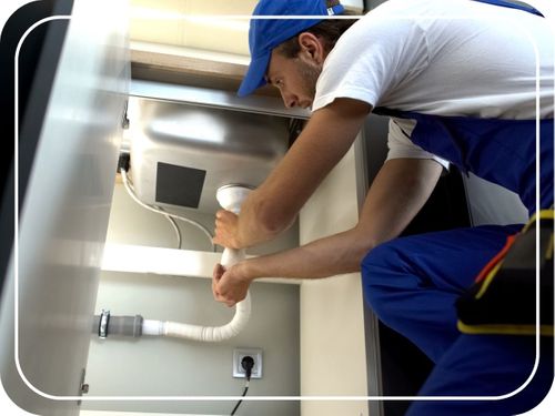 worker adjusting pipes worker adjusting pipes