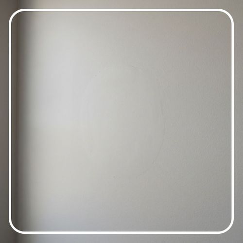 Smoothly patched drywall blending perfectly into a home interior wall