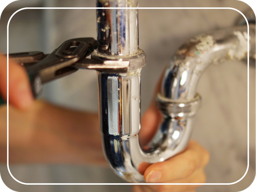plumber fixing u bend pipe