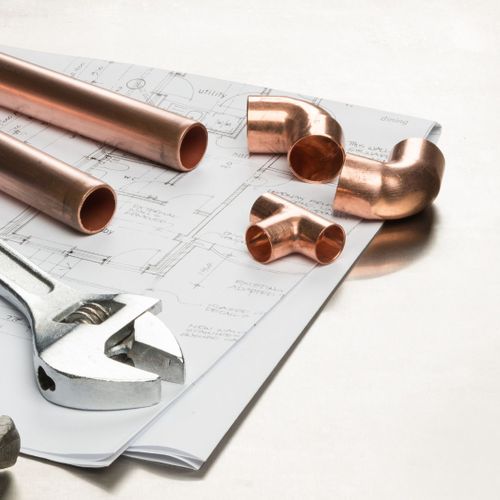 copper pipe pieces and plumbing tools