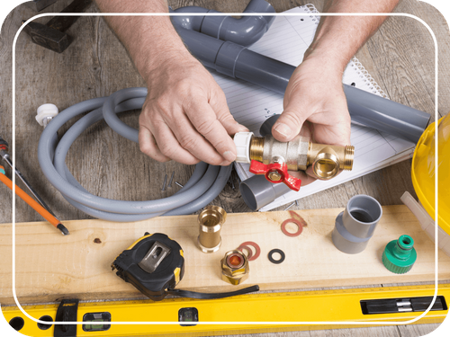 plumber working with piping