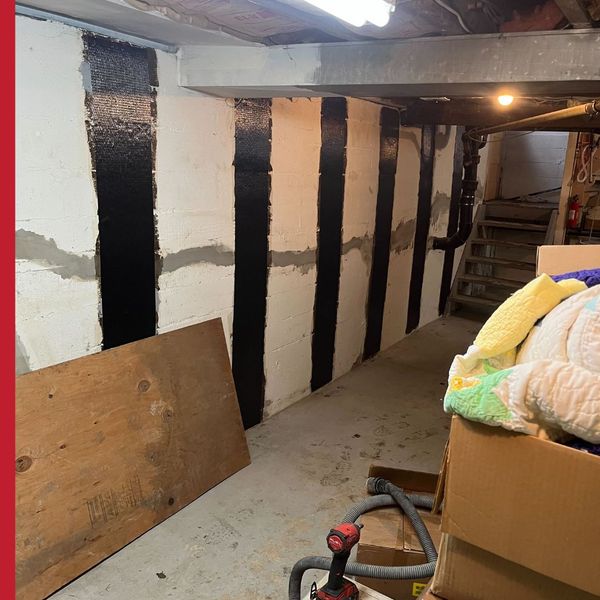 patched and protected concrete wall in basement