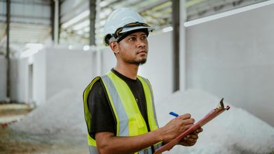 specialist holding clipboard in commercial space specialist holding clipboard in commercial space
