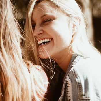 An image of a woman laughing.