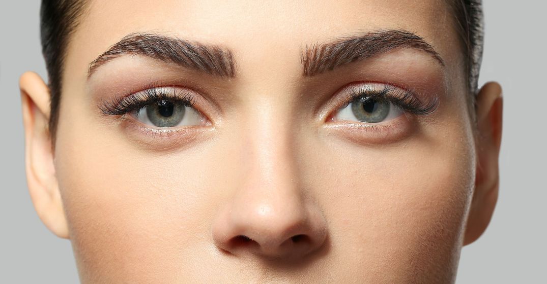 a beautiful face with dark, full eyebrows