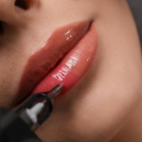 woman gets permanent makeup on her lips