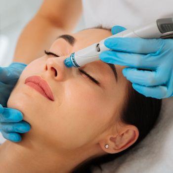 An image of a woman getting a HydraFacial.