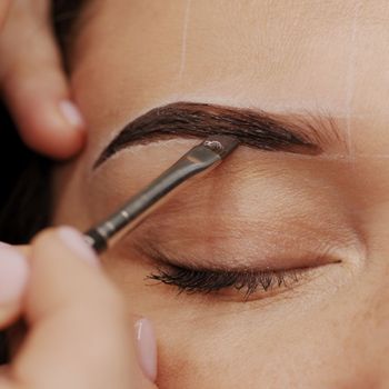 pigment being applied to an eyebrow